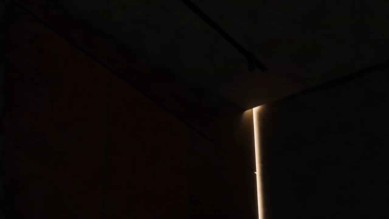 Laser alignment, exact stone placement, and quiet supervision on a refined wellness construction site.